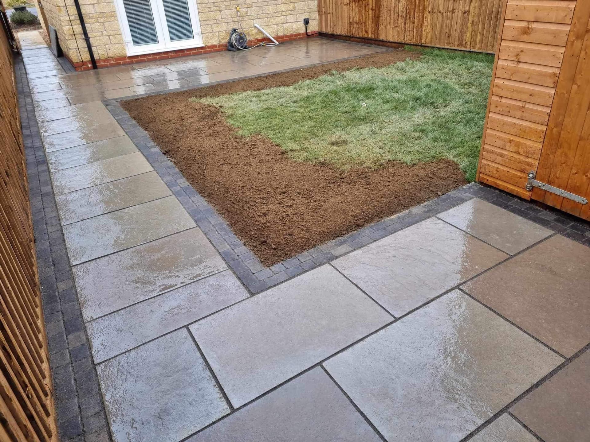 Block paved patio with steps, Corby